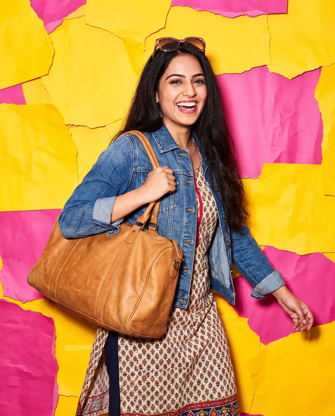 Woman carrying a leather travel tote